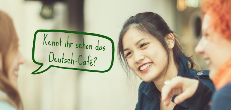 Menschen, die neu in Augsburg sind, üben gemeinsam Deutsch im Deutsch-Café bei Tür an Tür.