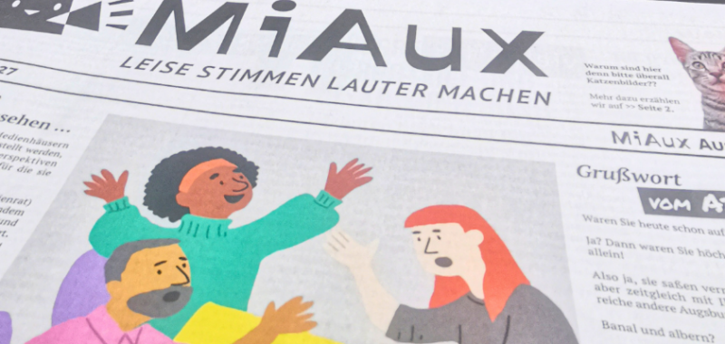 Mi Aux im Tür an Tür Café lesbar