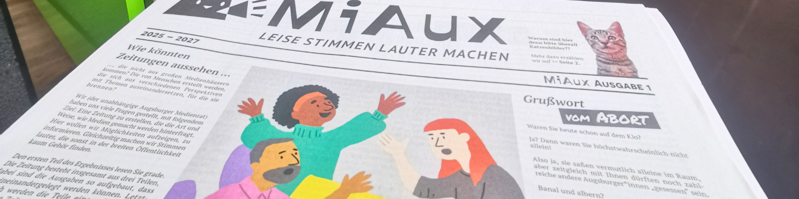 Mi Aux im Tür an Tür Café lesbar